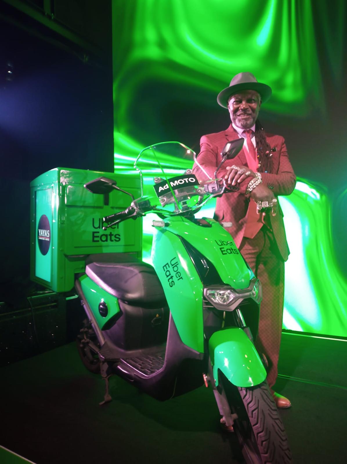Levi Roots and the Vmoto CPx on stage at the Uber Eats Restaurant of the Year Awards